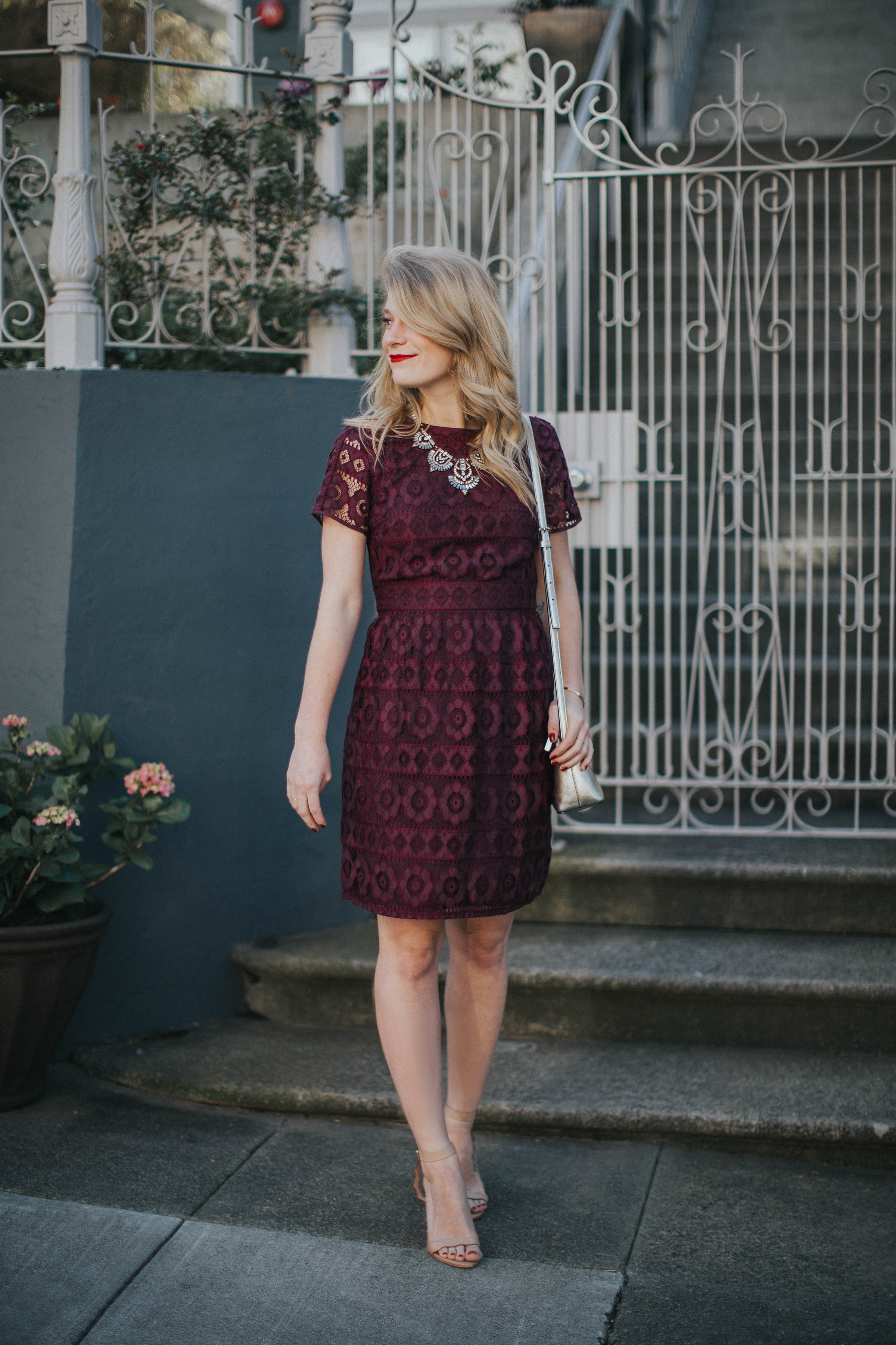 This purple LOFT lace dress is the best for spring weddings paired with a BaubleBar statement necklace and Loeffler Randall sandals.